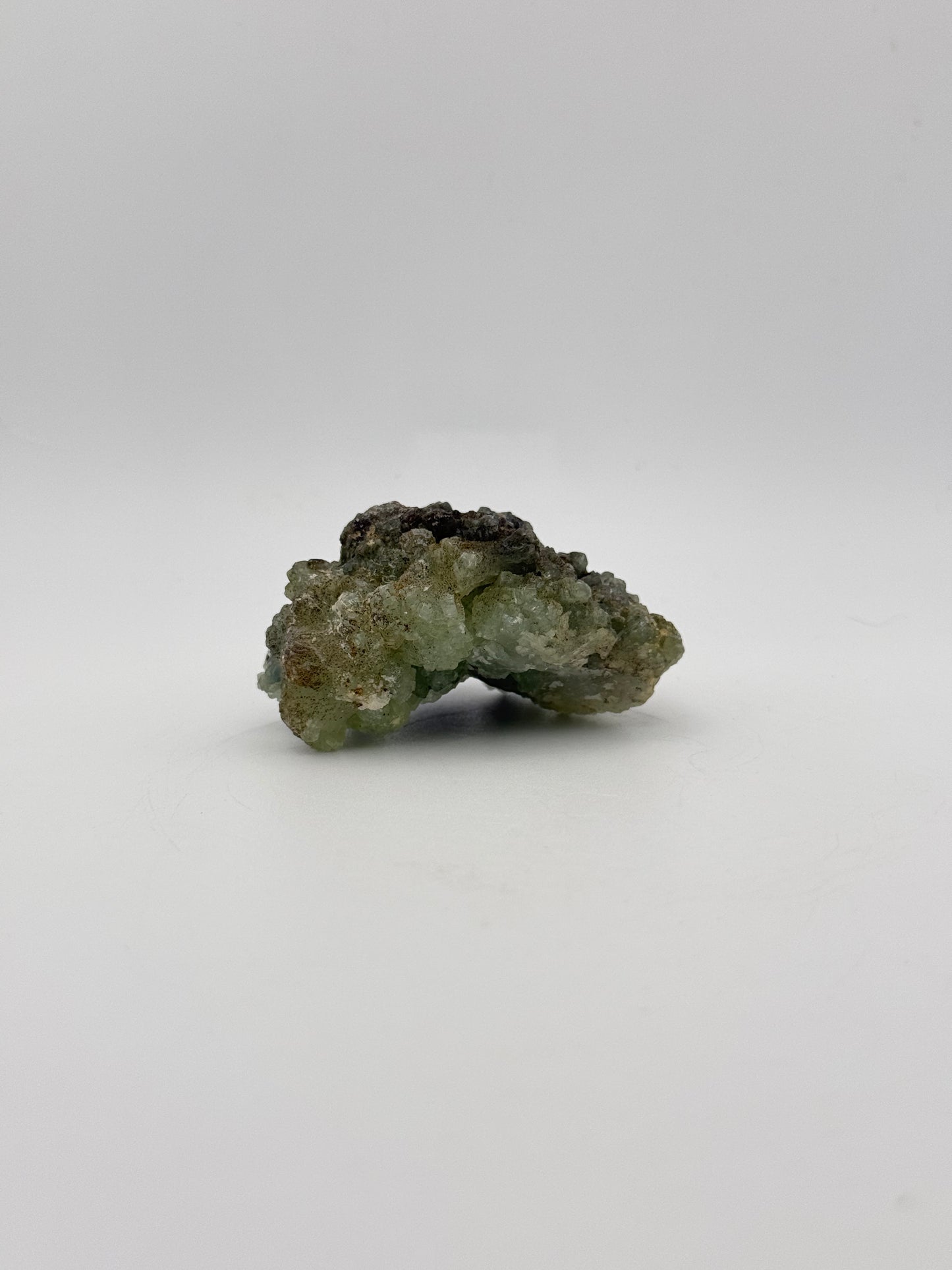 Raw Prehnite specimen with amazing green color.