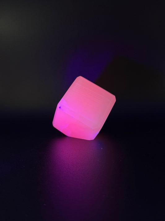 Polished Pink Calcite cut cube. Pink calcite is uv reactive.