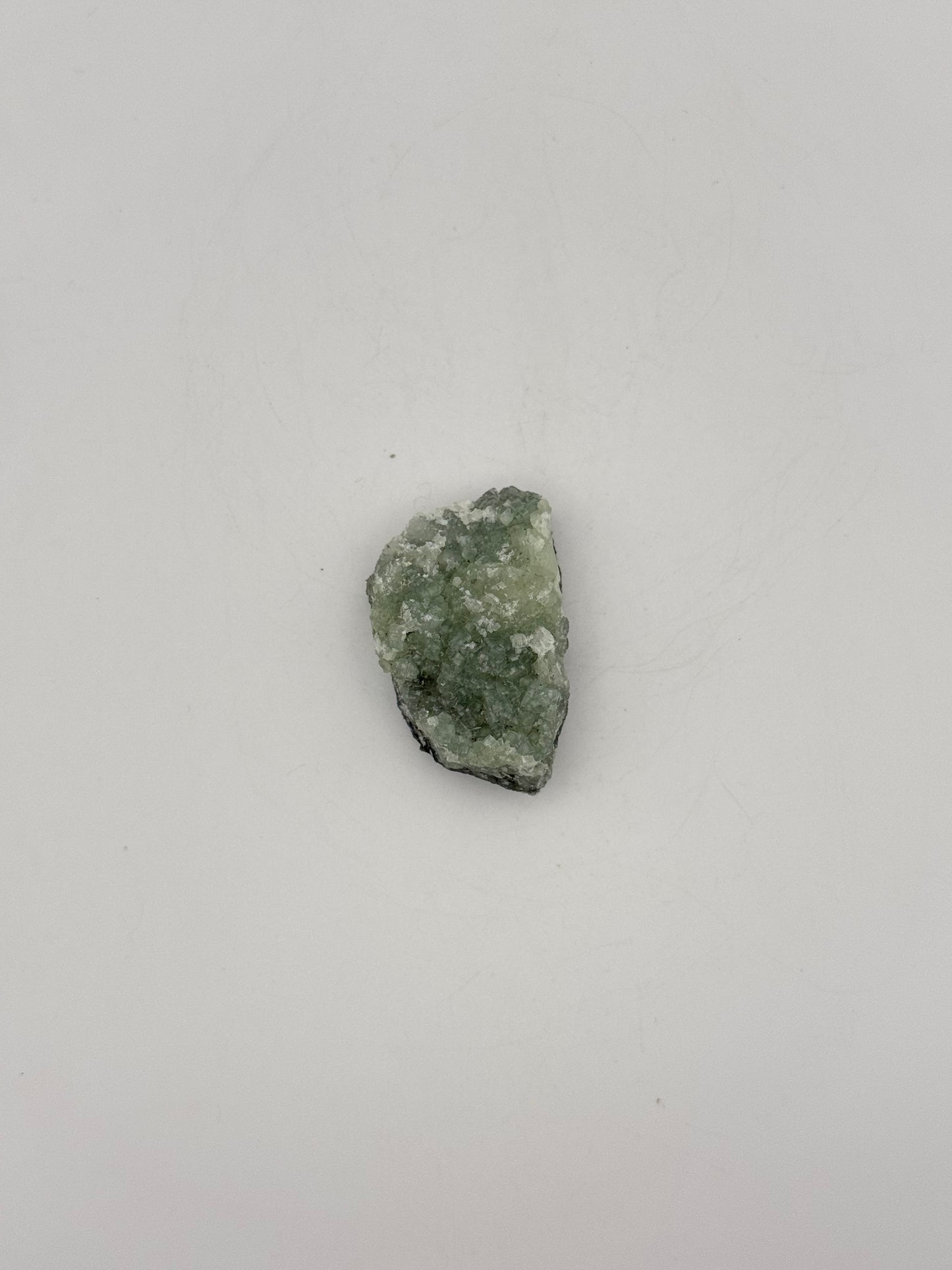 Raw Prehnite specimen with amazing green color.