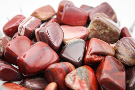 Polished poppy jasper tumbles.