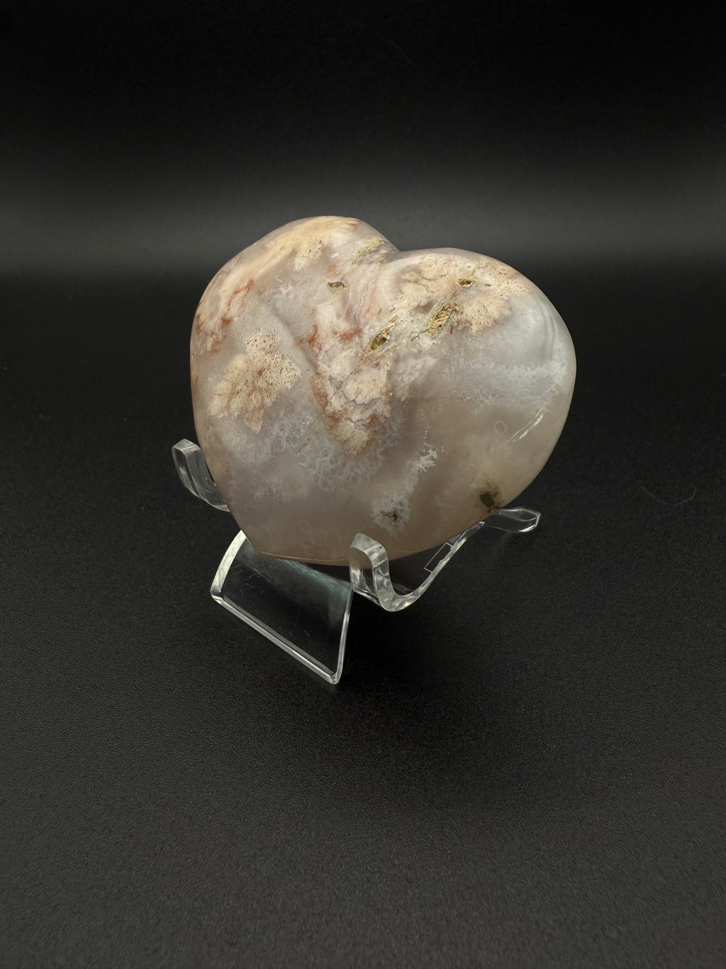 Heart-shaped polished flower agate crystal.