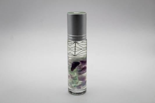 Roll on bottle with essential oils and crystals inside.
