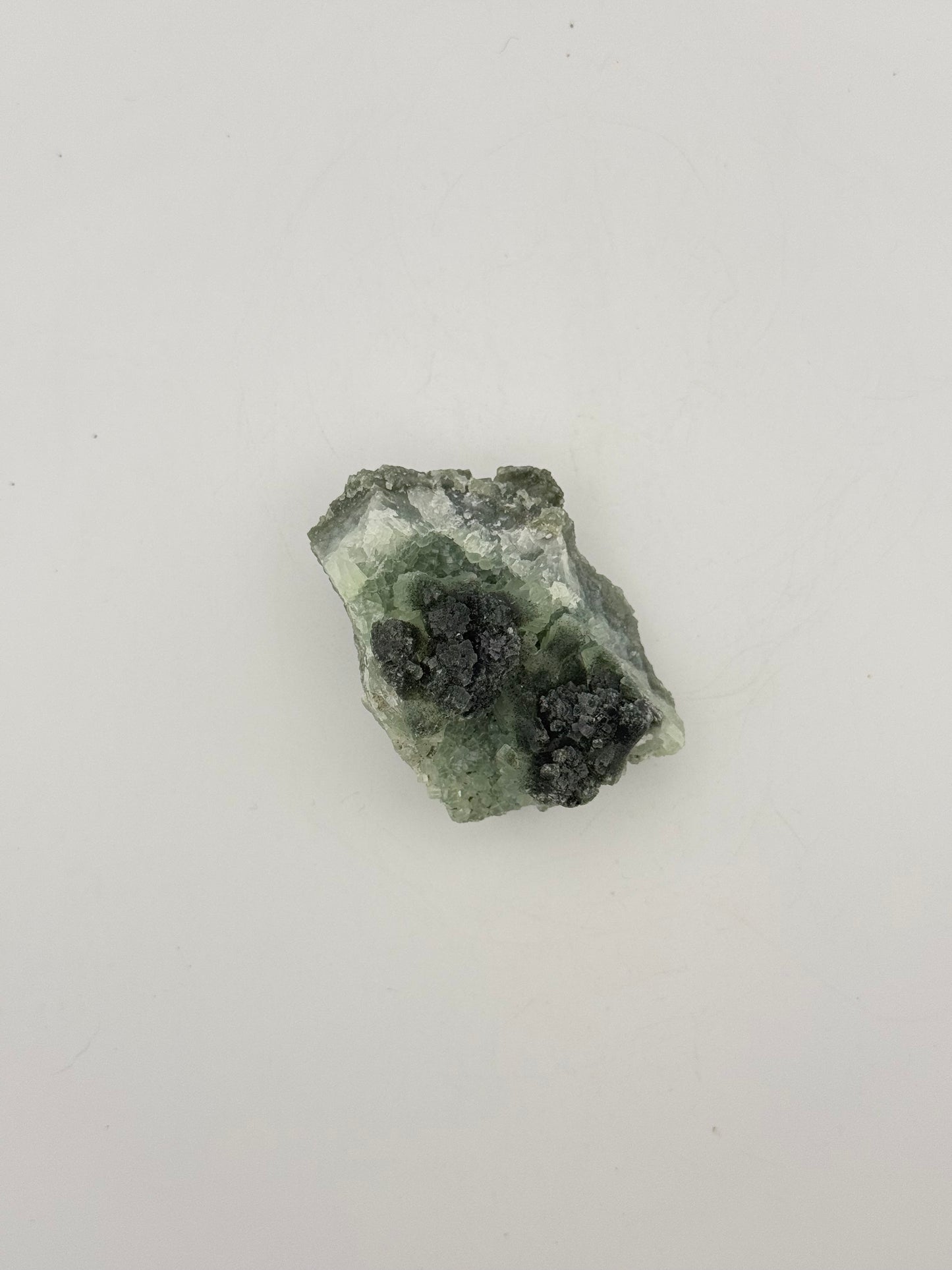 Raw Prehnite specimen with amazing green color.