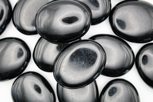 A collection of Black Obsidian Pillows