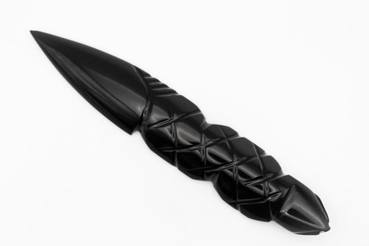 A black obsidian dagger with a medium-sized, intricately patterned handle.