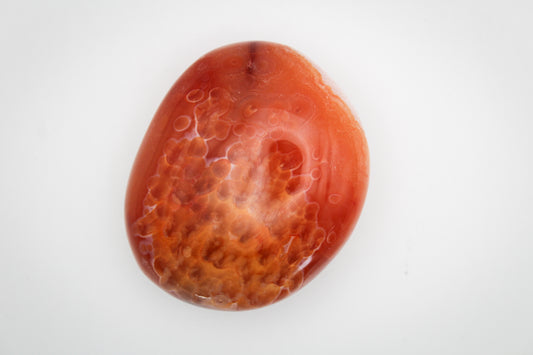 Carnelian crystal palmstone with visible patterns