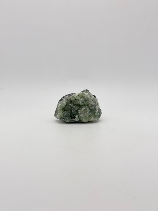 Raw Prehnite specimen with amazing green color.