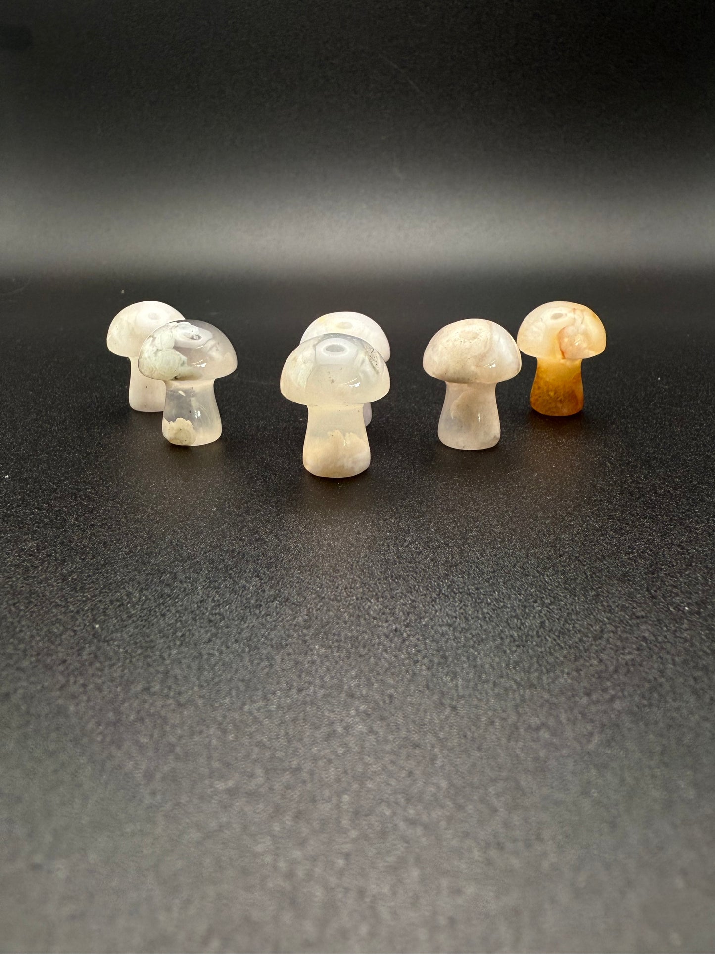 Polished flower agate crystal in the shape of mini mushrooms
