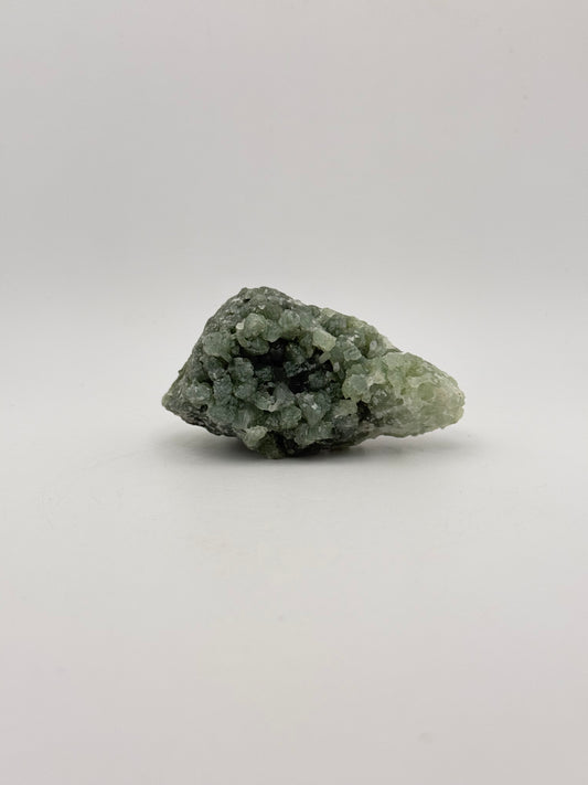 Raw Prehnite specimen with amazing green color.