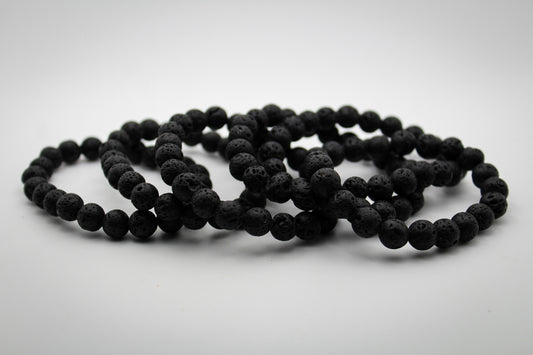 A black lava stone bracelet with a solid pattern. 8mm size beads.