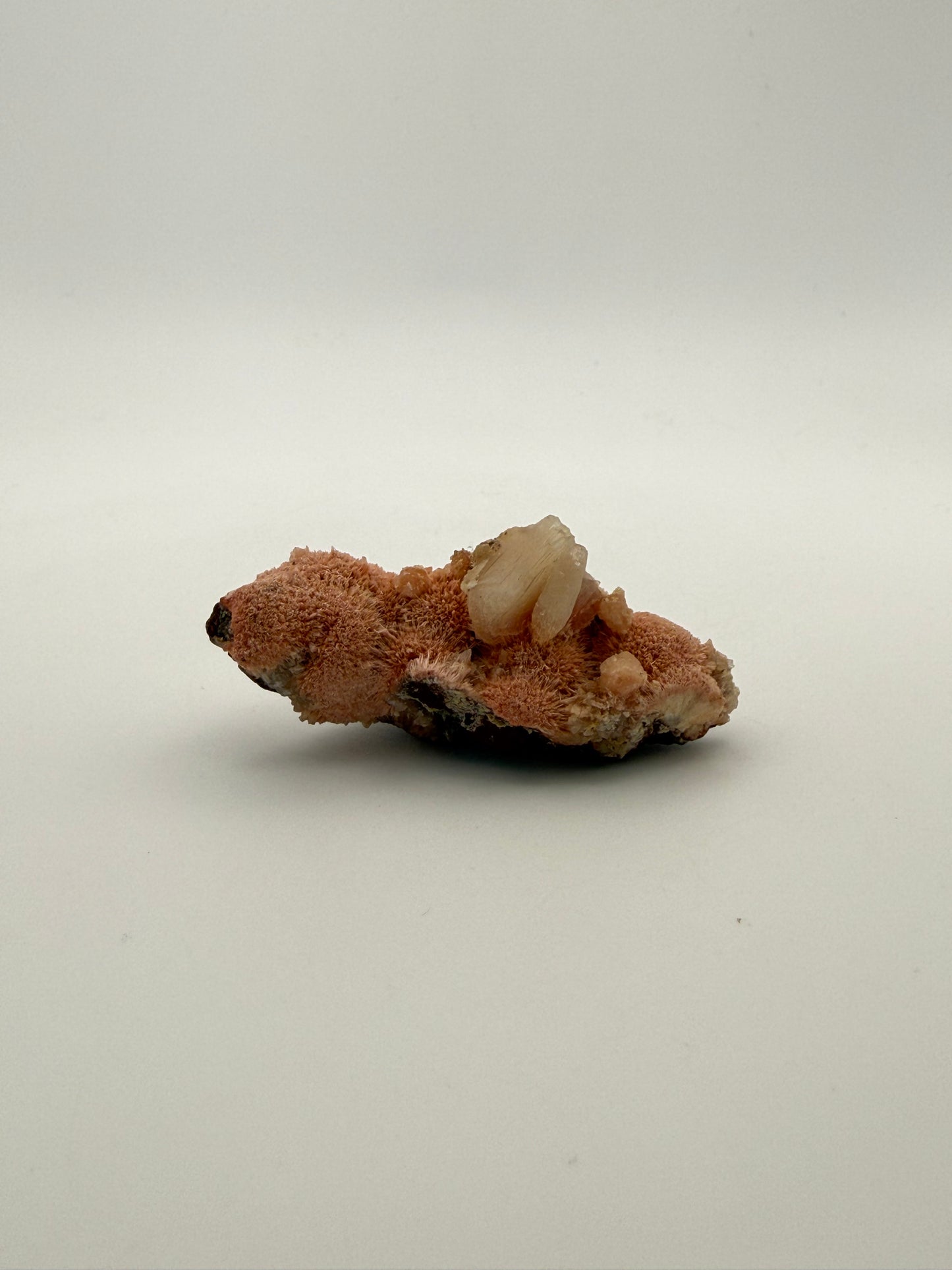 Raw Messolite crystal.