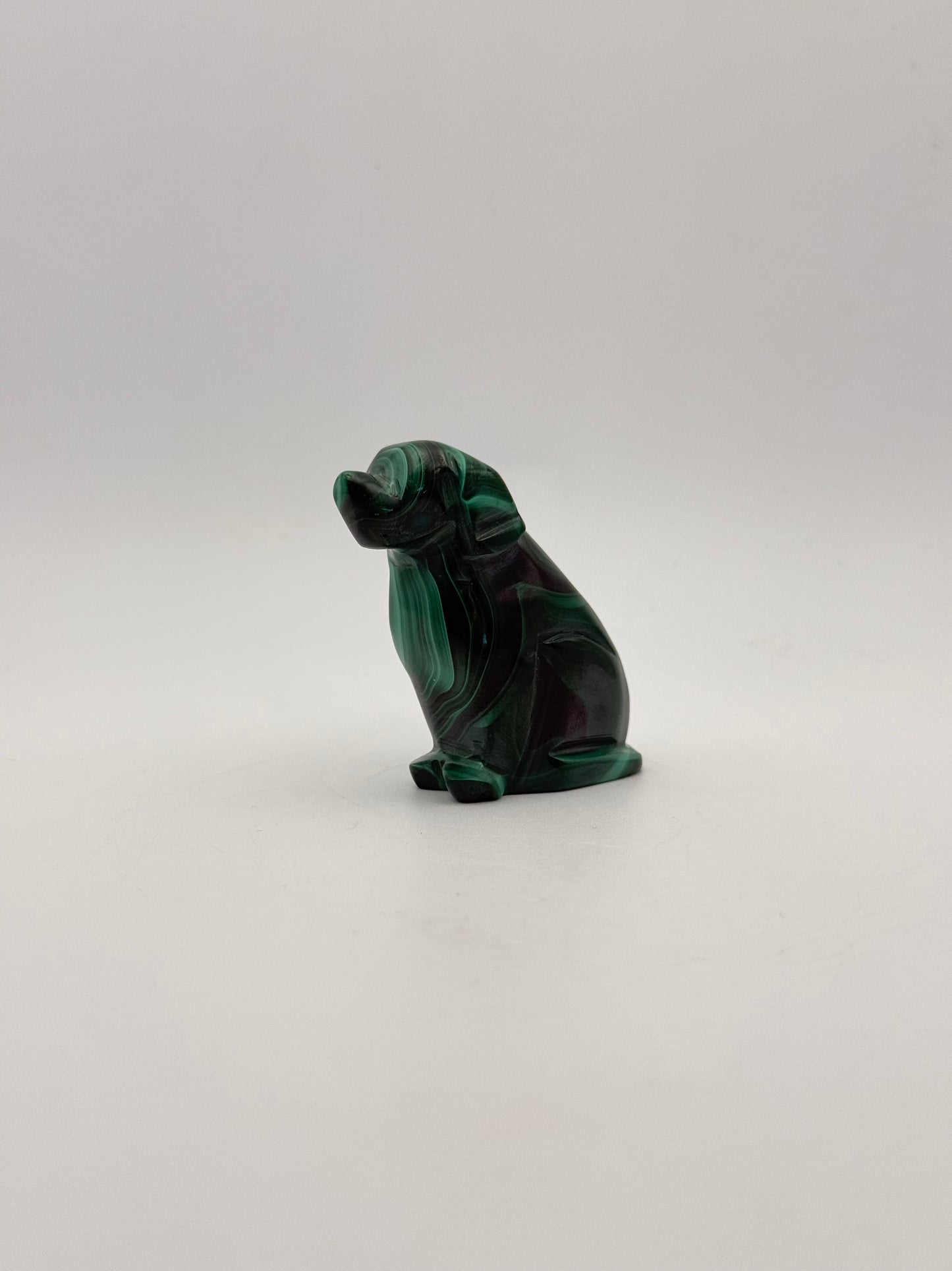 Polished malachite dog carving.