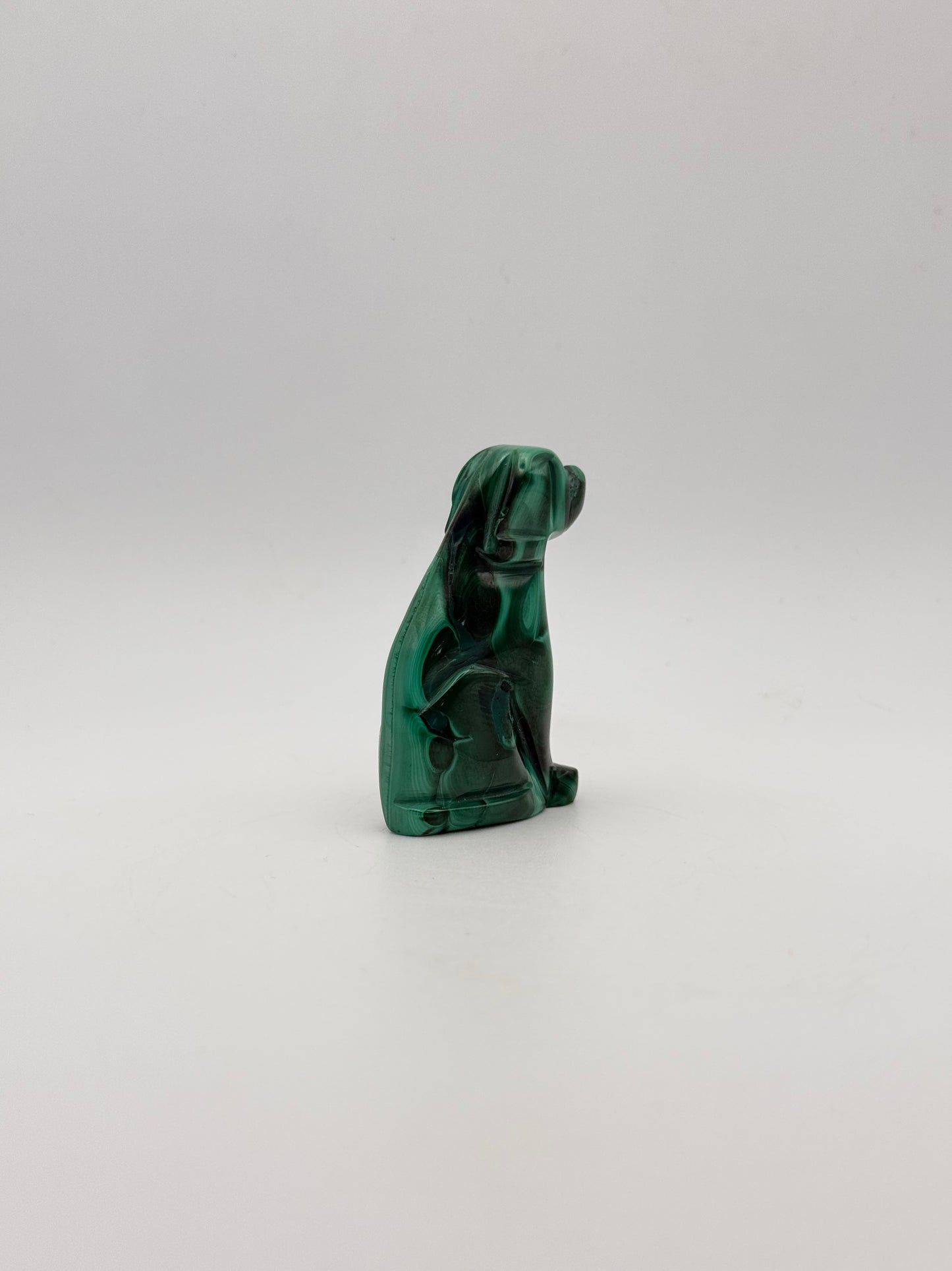 Polished malachite dog carving.