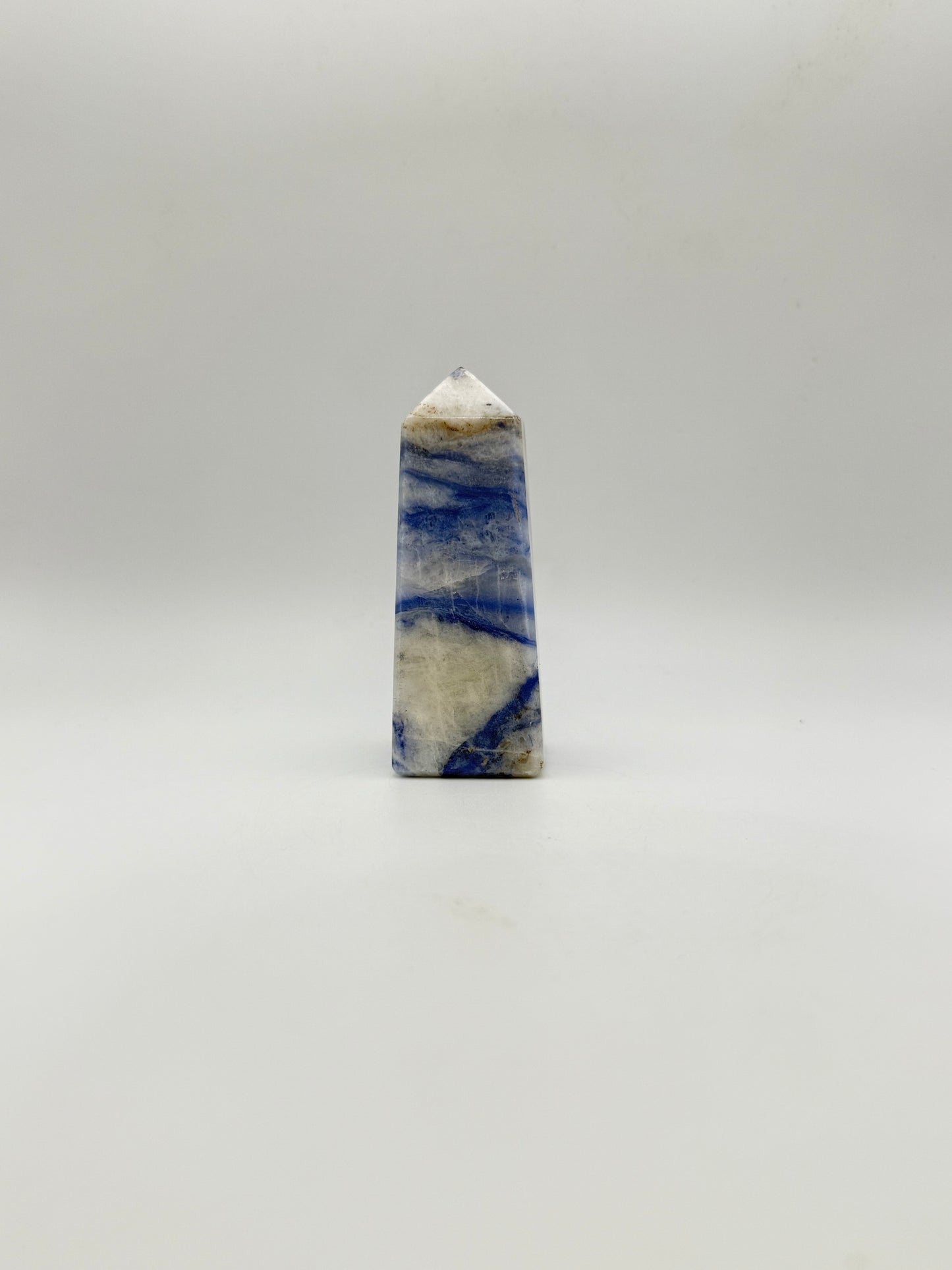 Afghanite four sided tower. Height of 3 1/4 inches, width of 1 1/4 inches.