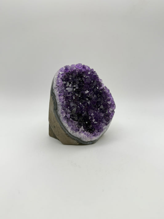 standing Amethyst cluster with deep purple crystals. about 3 1/2inches tall.