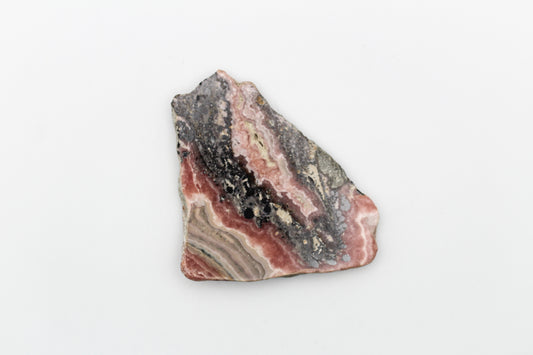 A polished rhodochrosite crystal slice.