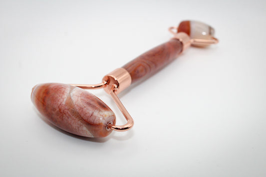 Massage roller made out of fire agate.