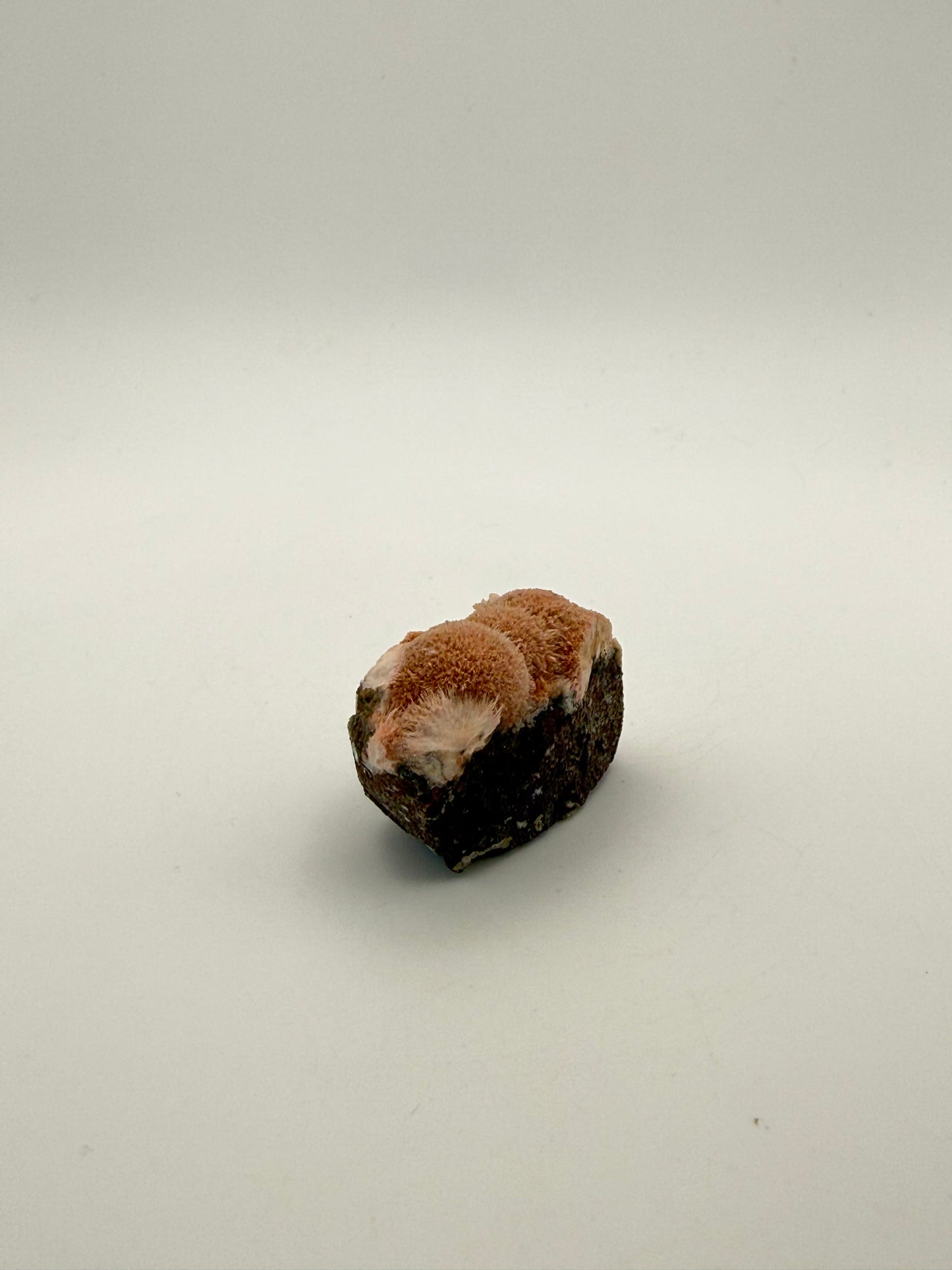 Raw Messolite crystal.