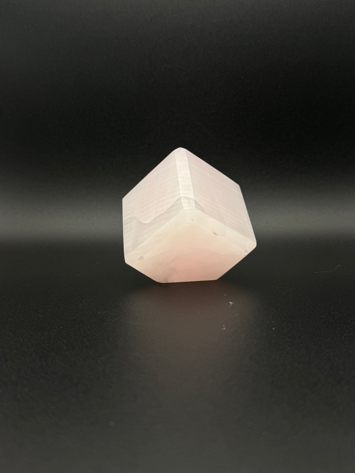 Polished Pink Calcite cut cube. Pink calcite is uv reactive.