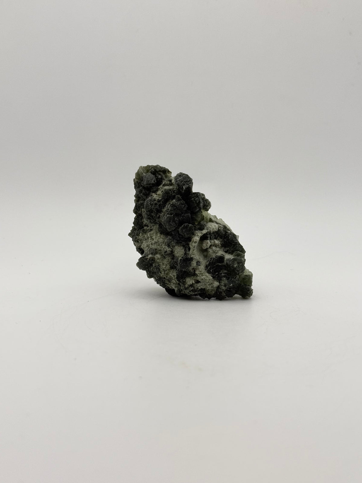 Raw prehnite specimen with amazing green color.