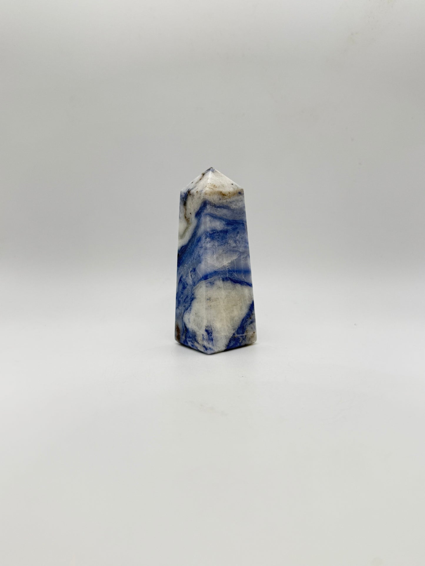 Afghanite four sided tower. Height of 3 1/4 inches, width of 1 1/4 inches.