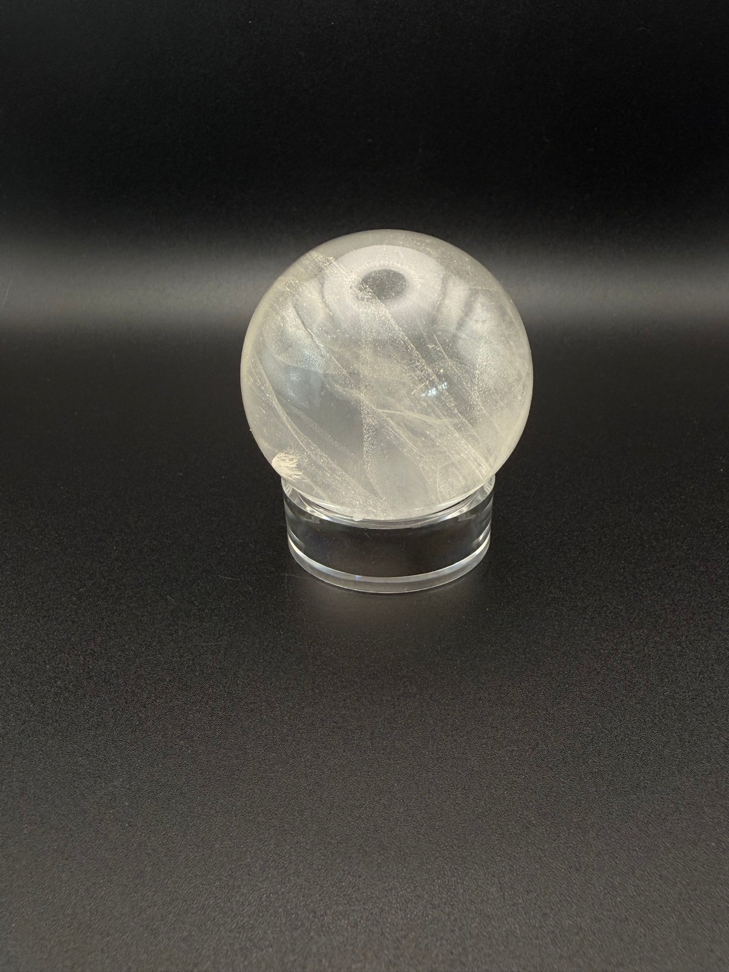 Clear quartz polished crystal sphere.