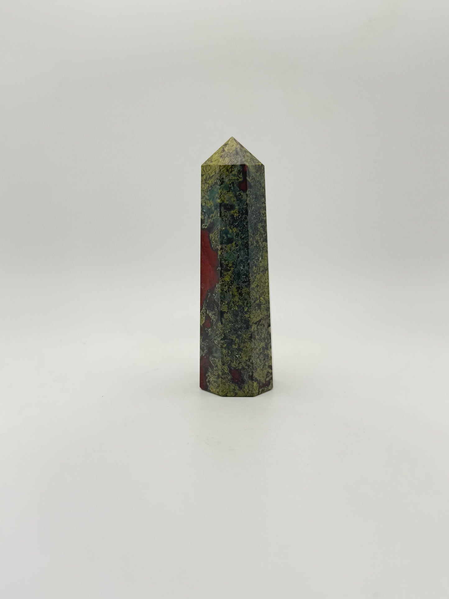 Polished Dragon Bloodstone in the shape of a tower.