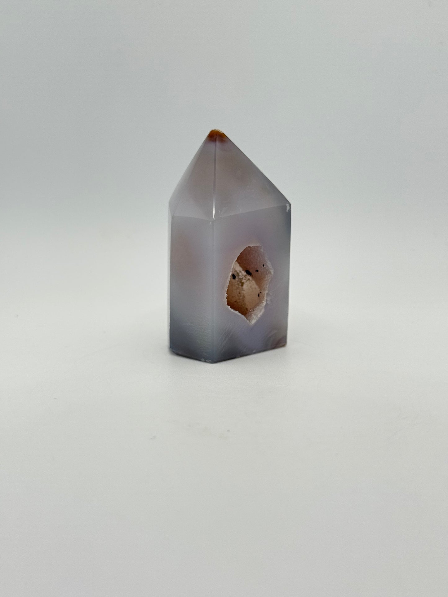 Polished druzy agate tower. About 2.5 inches tall.