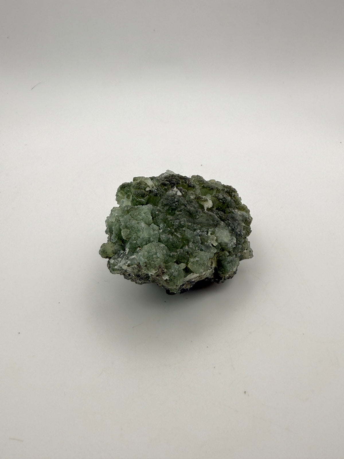 Raw Prehnite specimen with amazing green color.
