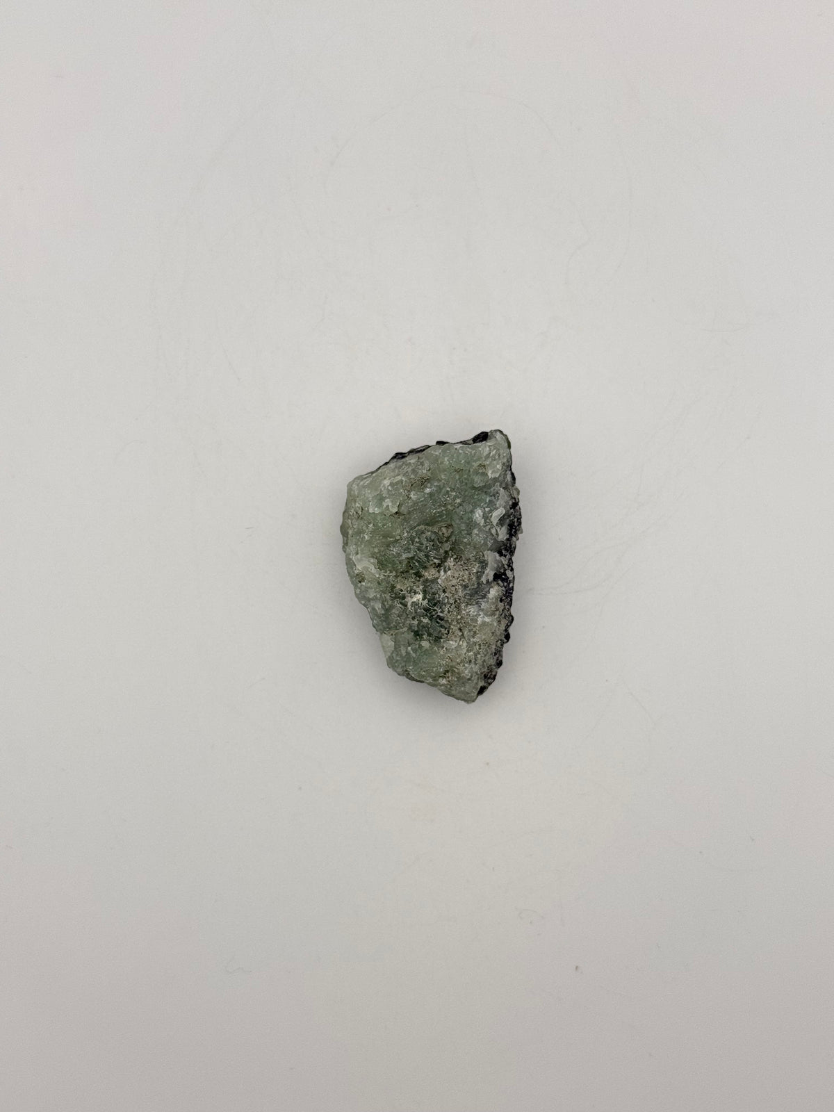 Raw Prehnite specimen with amazing green color.