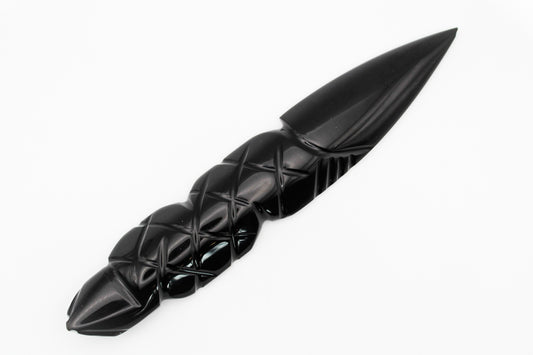 A black obsidian dagger with a medium-sized, intricately patterned handle.
