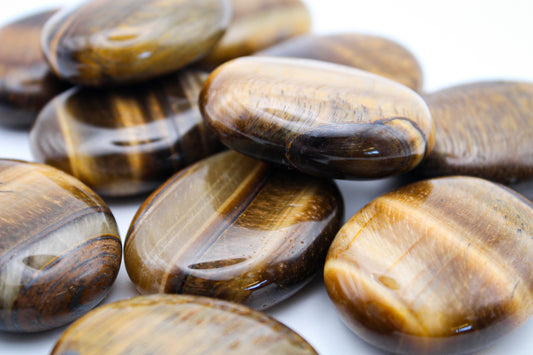 Yellow tiger eye palmstones.