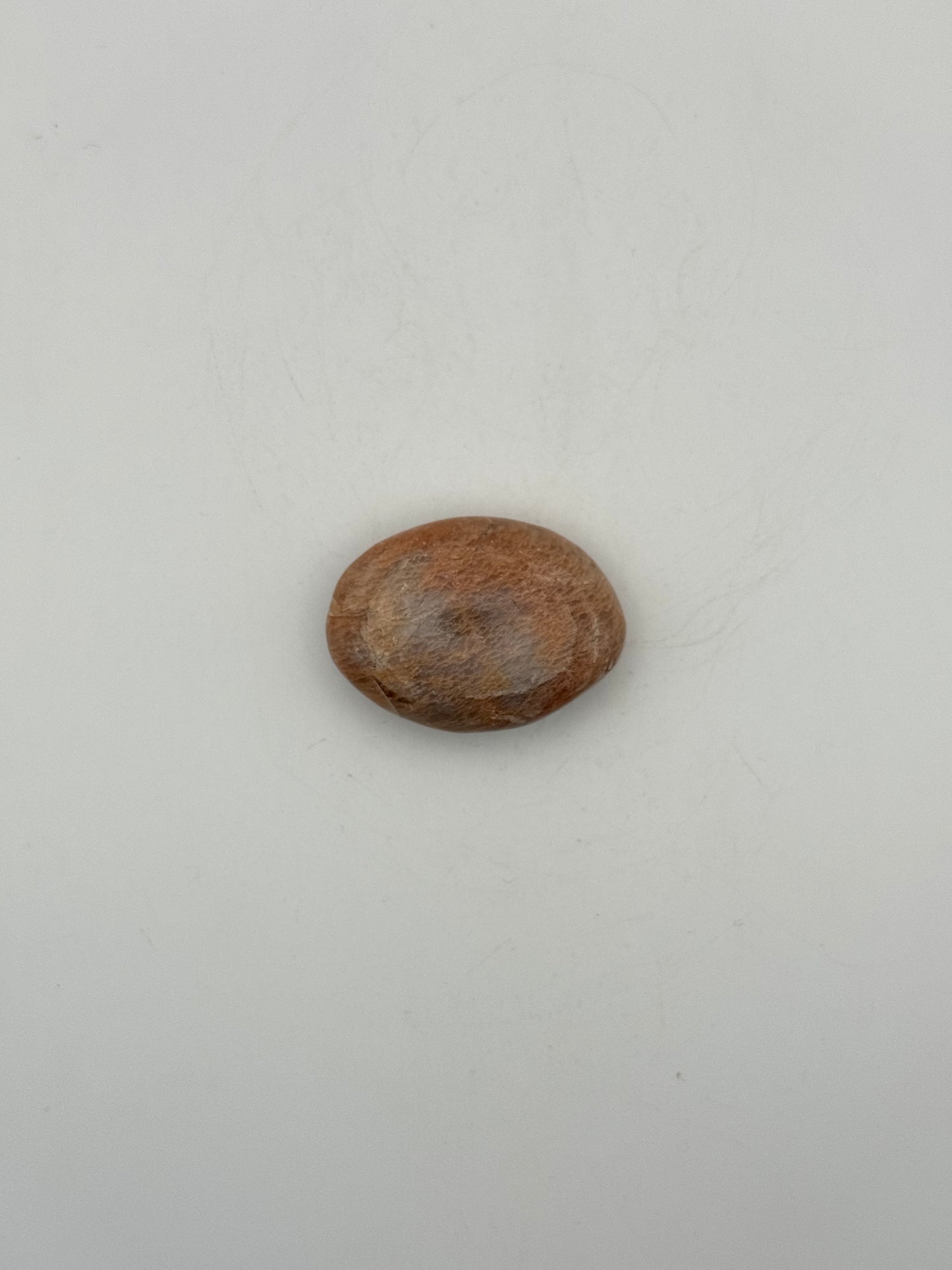 Polished Peach moonstone palm stone.