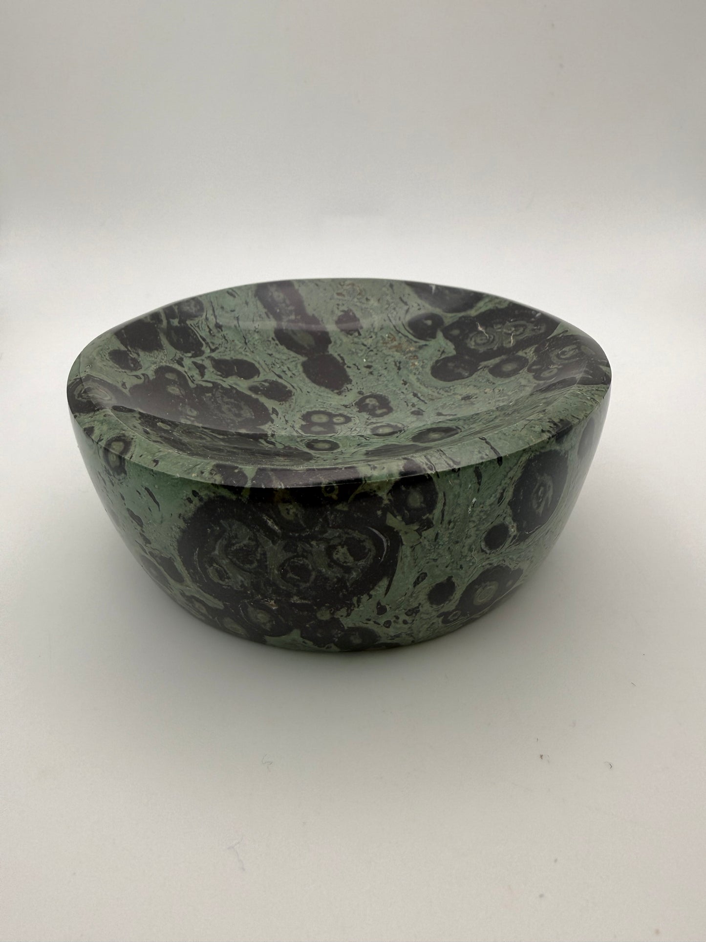 Polished kambaba jasper in the shape of a bowl.