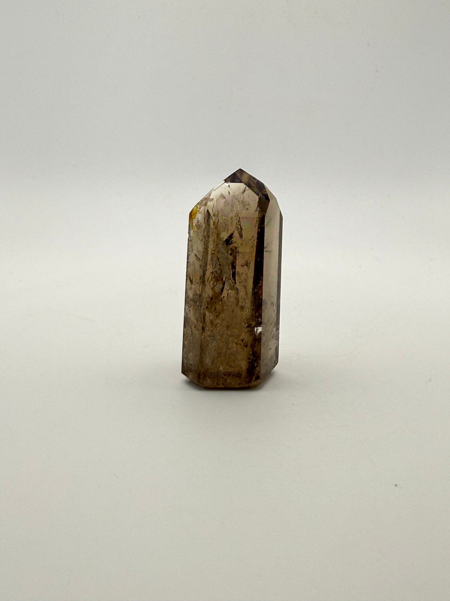 Polished natural citrine point.