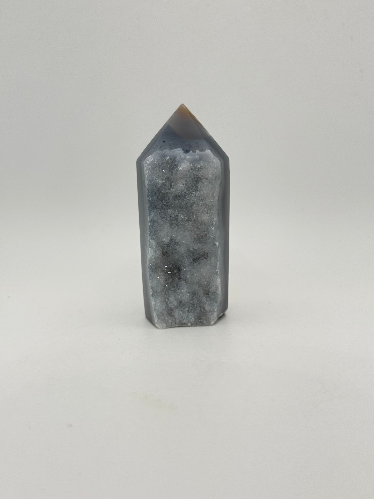 Polished druzy agate tower. About 3 inches tall.