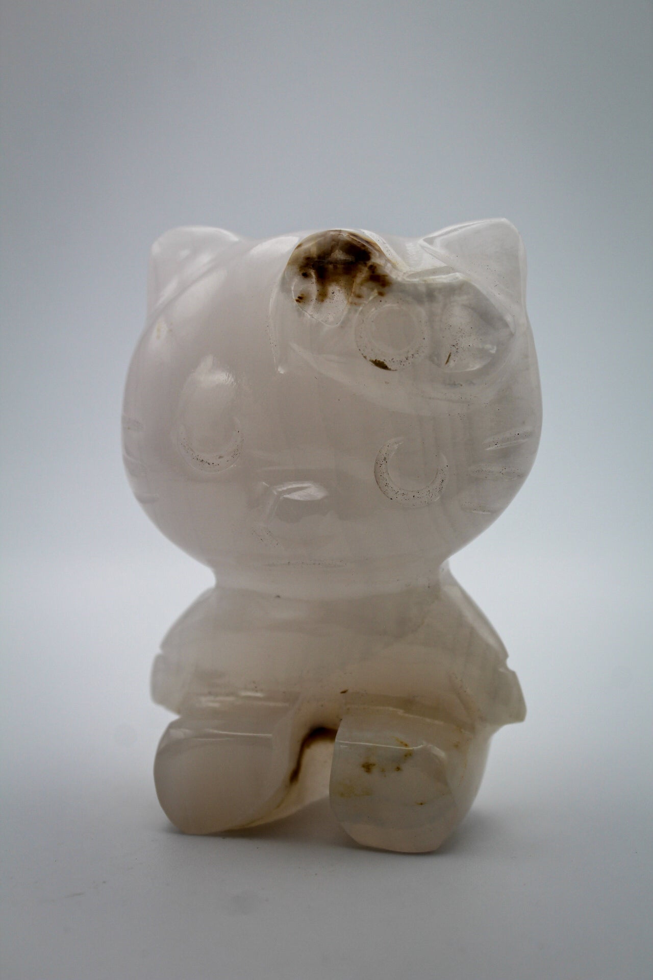Pink Calcite crystal in the shape of Hello Kitty.
