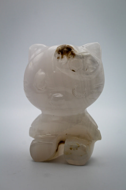 Pink Calcite crystal in the shape of Hello Kitty.