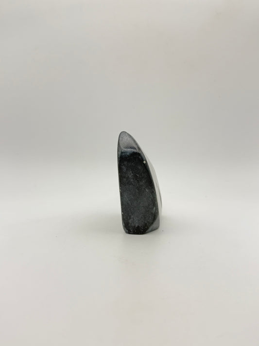 Polished green jade free form.