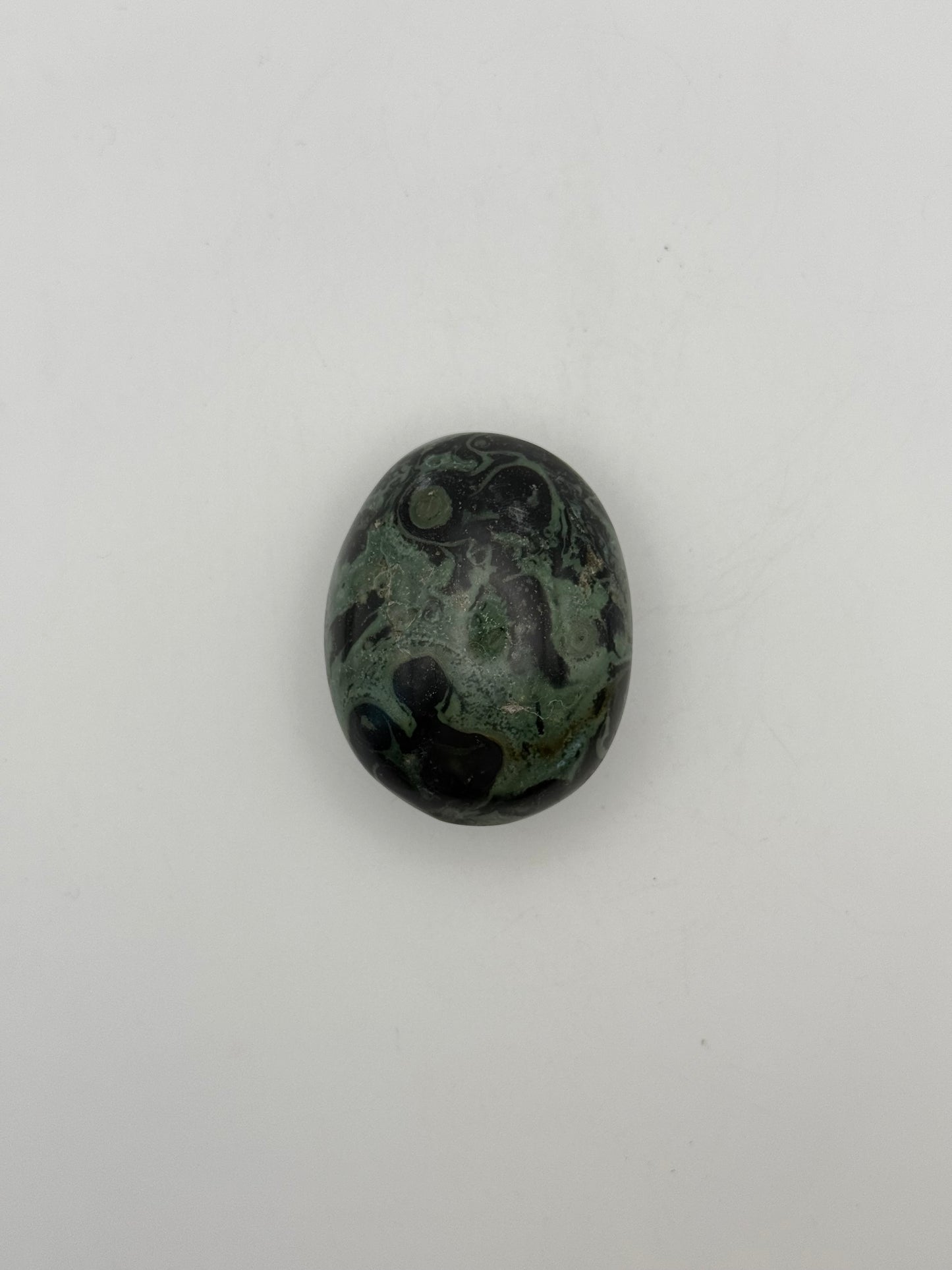 Polished kambaba jasper palm stone.