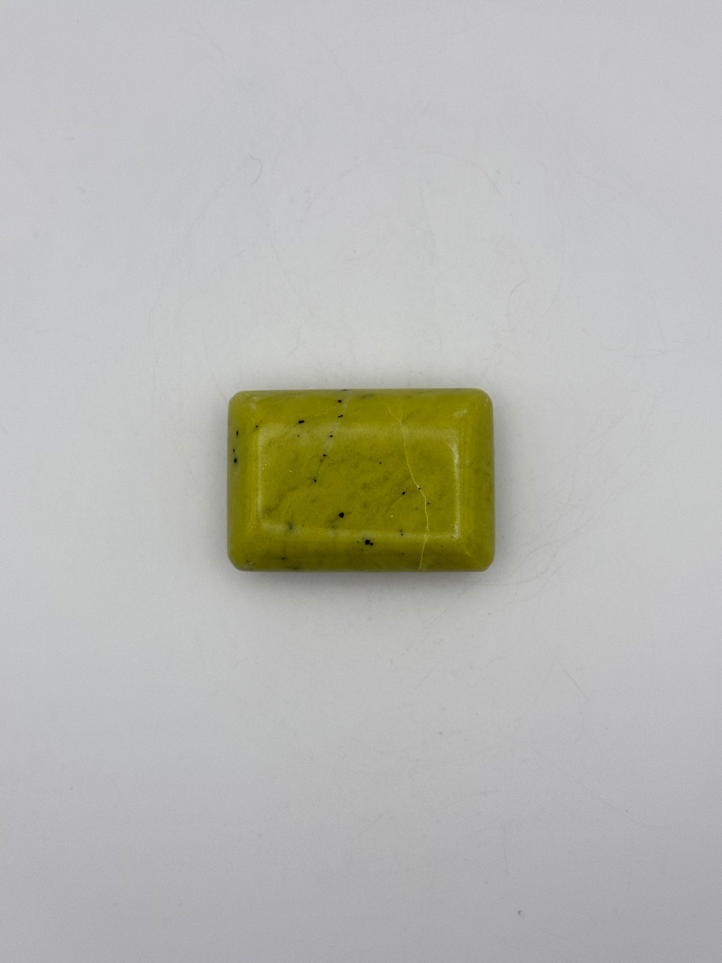 Polished healerite in the shape of a rectangular soap.