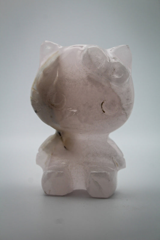 Pink Calcite crystal in the shape of Hello Kitty.