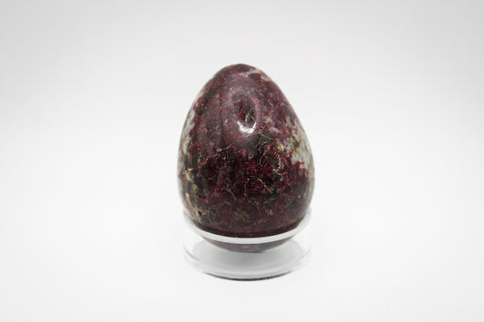Polished pink tourmaline in the shape of an egg.