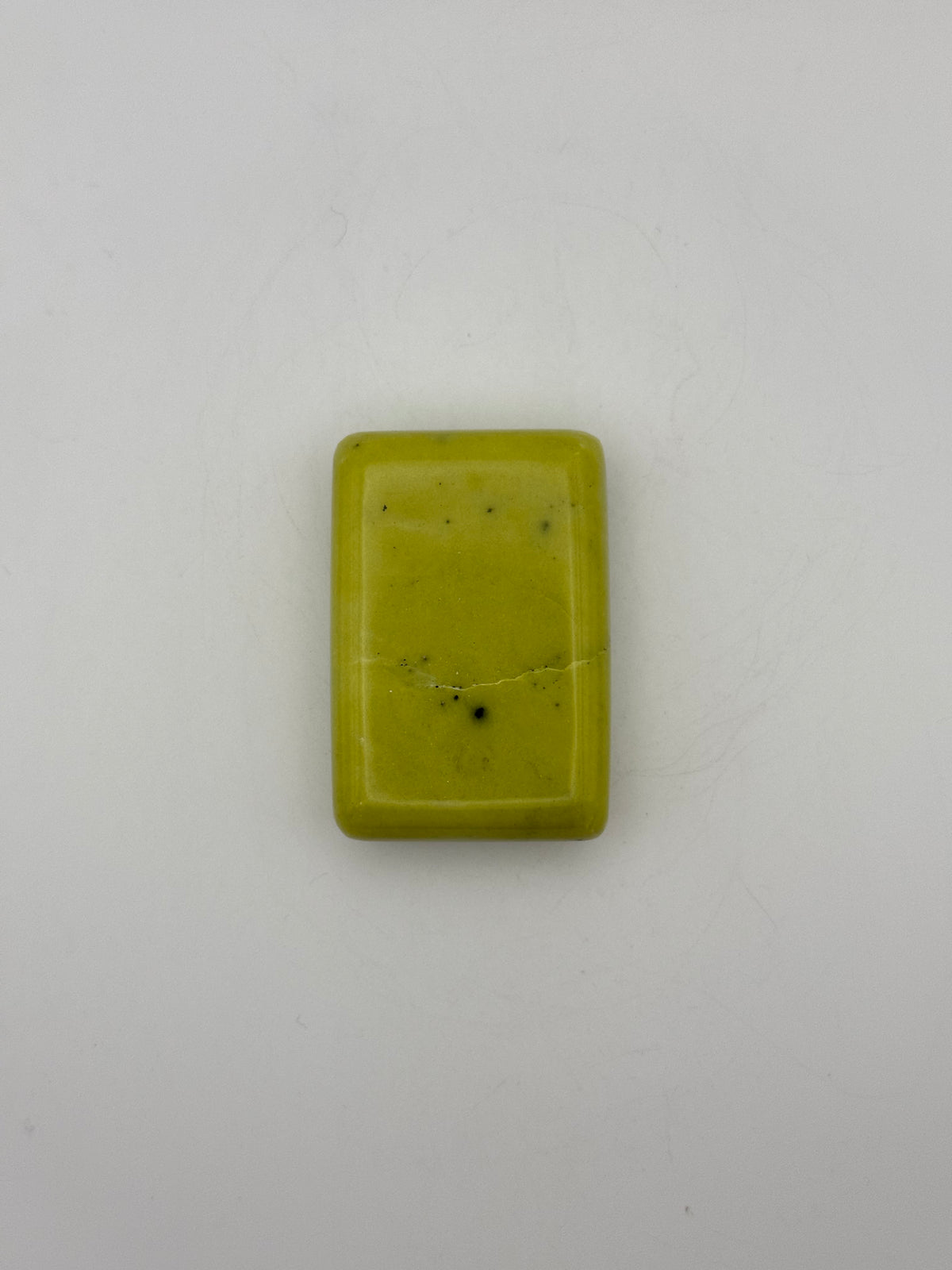 Polished healerite in the shape of a rectangular soap.