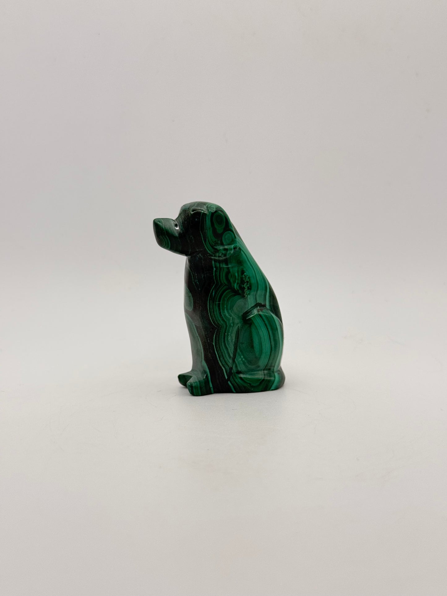 Polished malachite dog carving.
