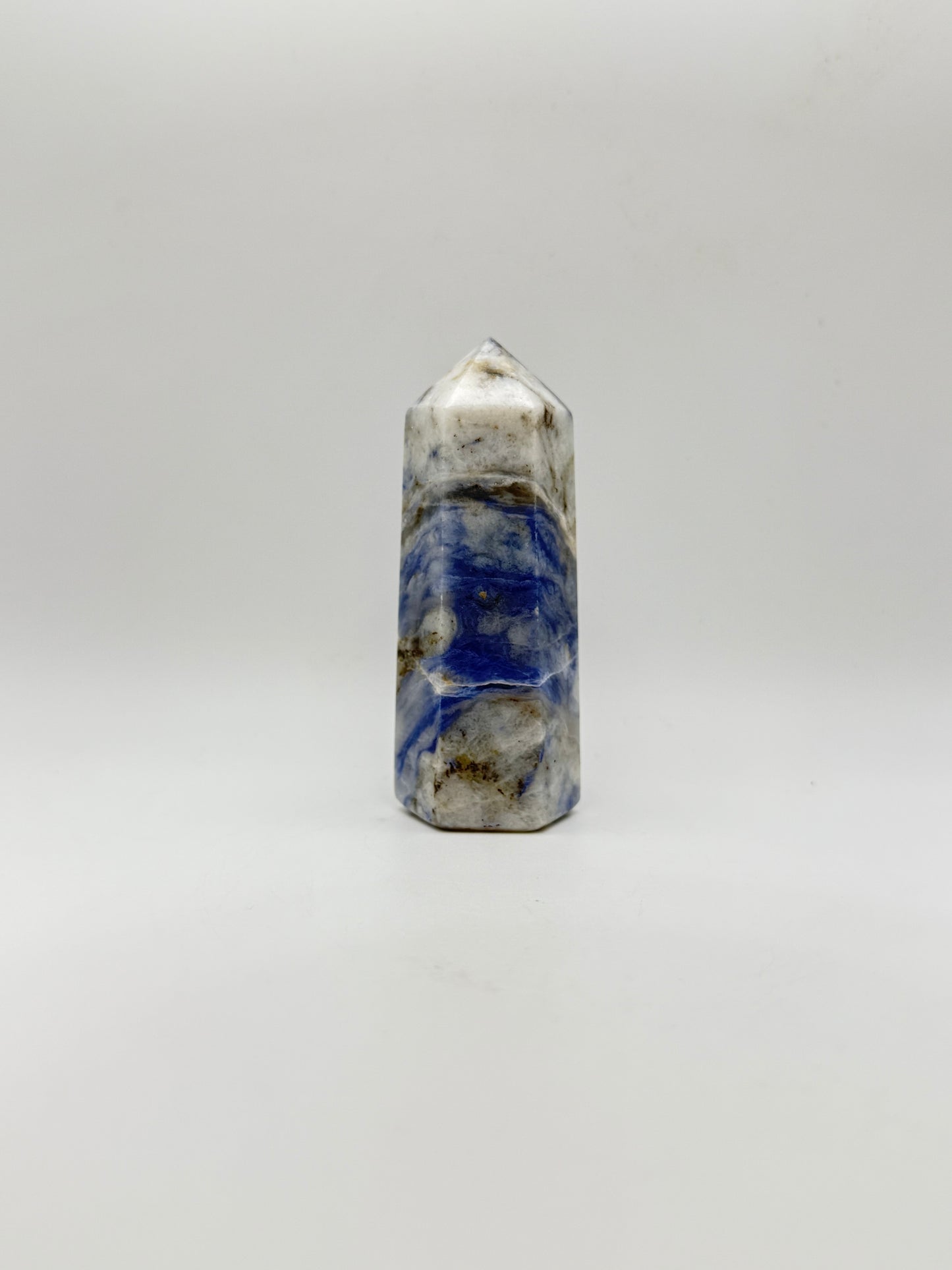 Afghanite six sided tower. Height of 3 3/4 inches, width of 1 1/2 inches.