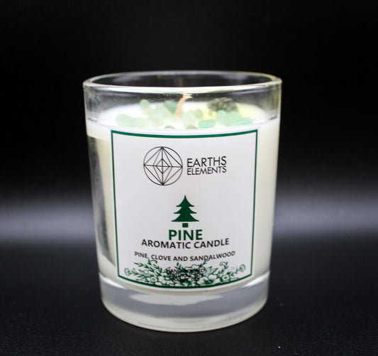 Pine candle with green aventurine chips and scent of pine, clove, and sandalwood.