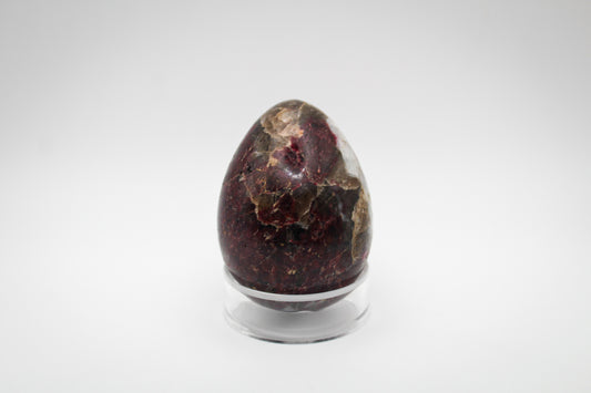 Polished pink tourmaline in the shape of an egg.