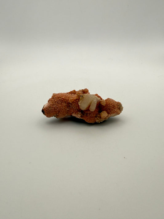 Raw Messolite crystal.