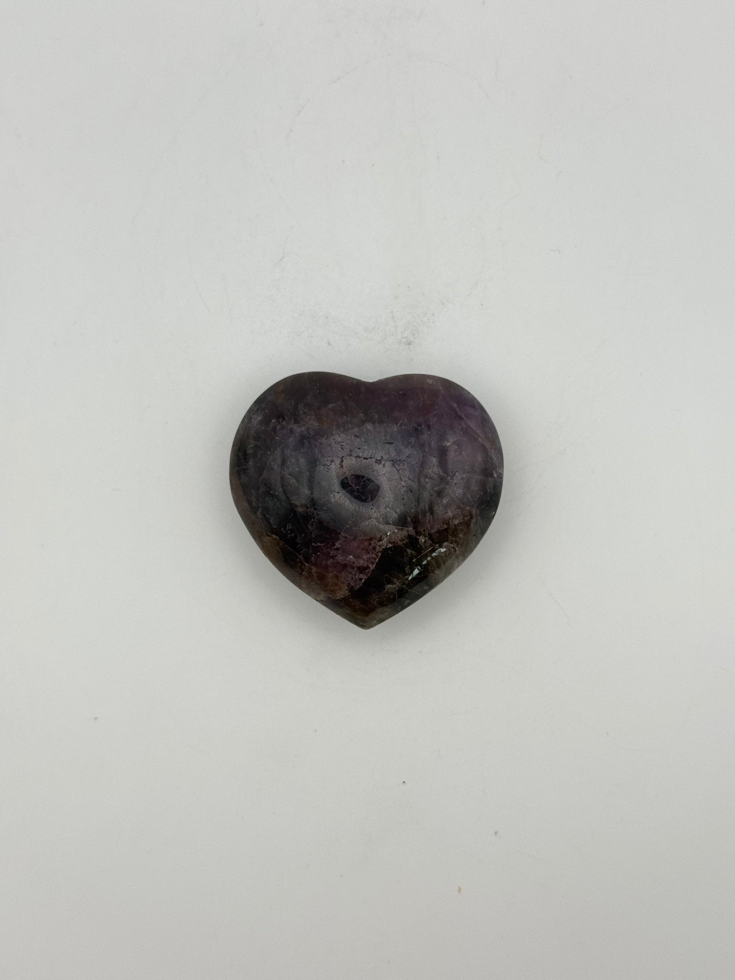 Polished super 7 in the shape of a heart.
